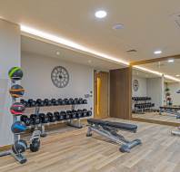 Gym with weights and large mirrors