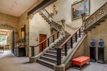 Stone staircase in lobby at Audley Sunningdale Park Sweeping stone staircase in mansion house