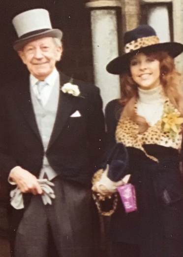 Owner at Audley Redwood in a Biba suit and hat at a wedding in 1972