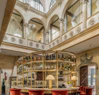 A large, horseshoe-shaped bar provides a prominent central focal point for the whole building and is set within the double-height atrium-bistro  Sunningdale Park horseshoe bar with atrium-bistro