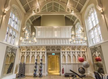 Weight training equipment in Victorian gothic hall