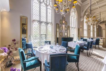 Restaurant tables in grand Victorian dining room