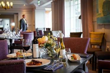 Restaurant table with wine and fine food