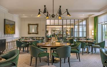 Luxury restaurant with green chairs