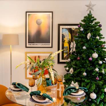 Dining table by a Christmas tree