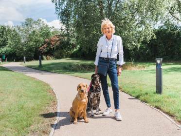 An open space, perfect for walking the dogs Owner with her dogs at Bristol retirement village